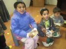 tasting the latkes while waitingn for our parents